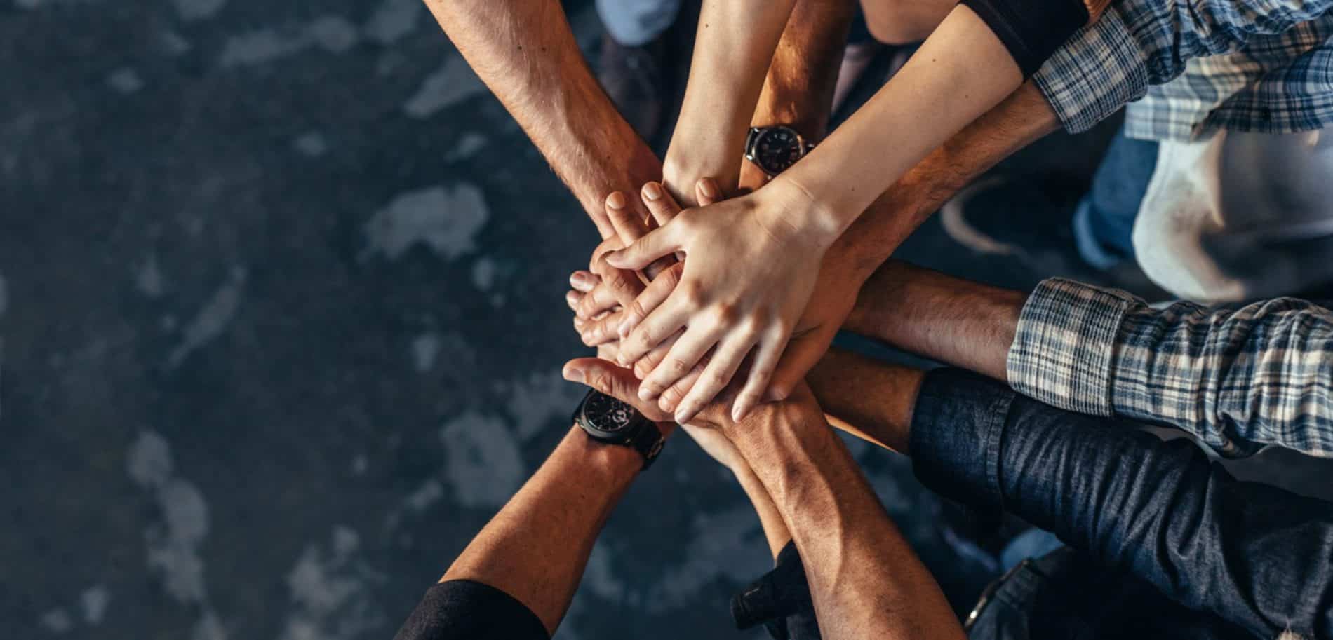 People putting their hands together